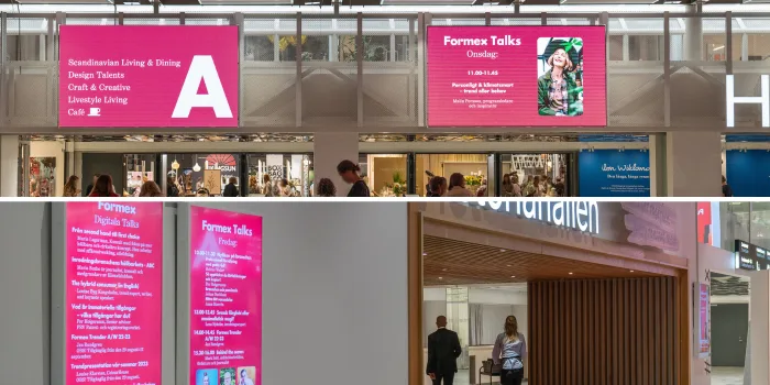 Large LED screens and vertical digital poster displays in the entrance areas at Stockholmsmässan, positioned near Hall A, Hall B and Victoria Hall.