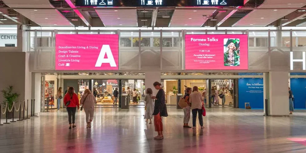 Digital screens above the entrance to Hall A at Stockholmsmässan, visible to visitors as they enter the hall.